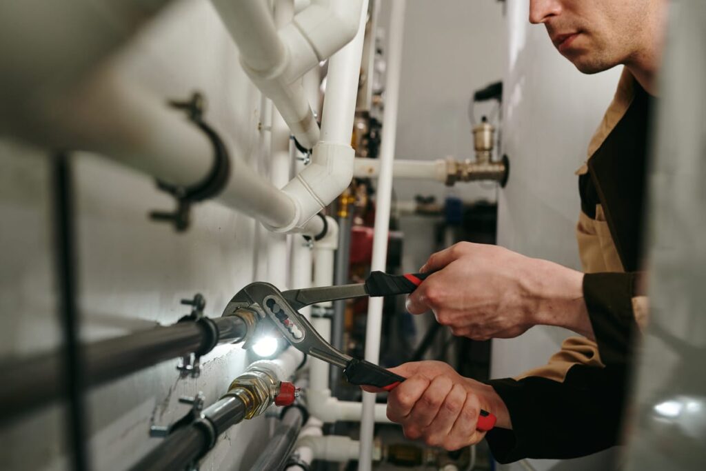 Plumbers maintaining commercial plumbing pipes in Loma Linda