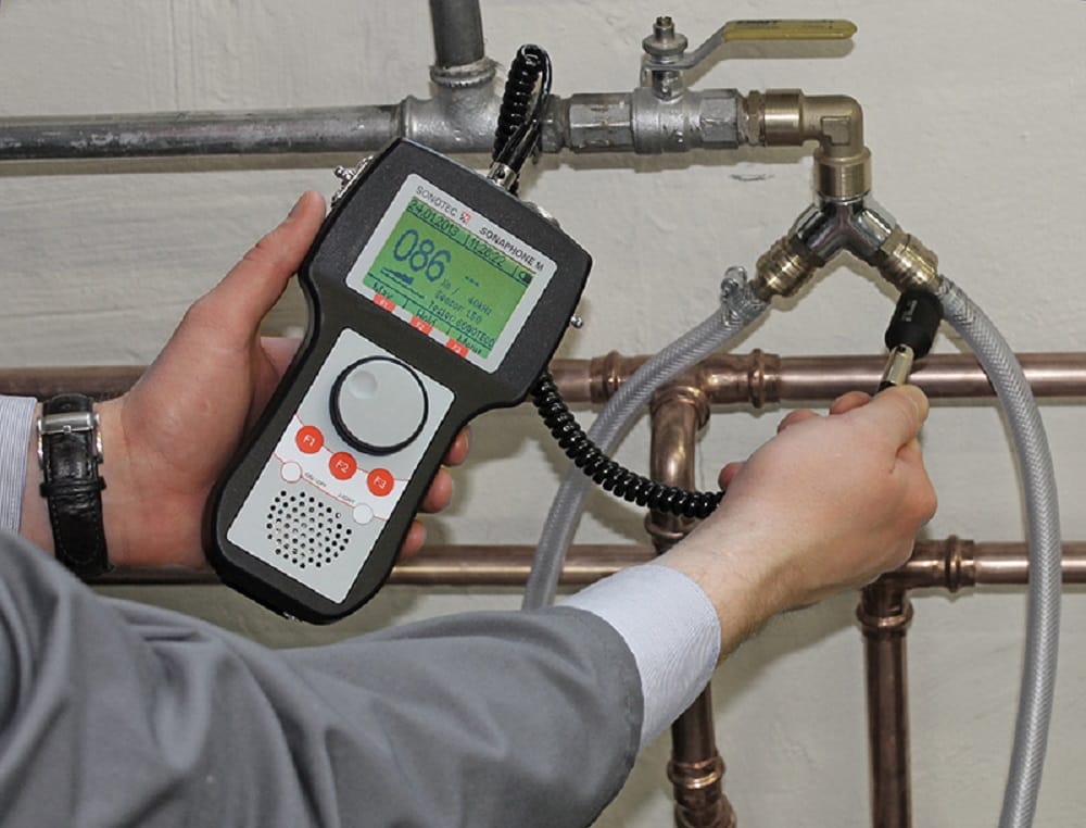 Plumber testing pipes with electronic leak detection equipment in Loma Linda