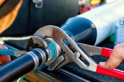 Technician tightening an industrial pipe connection in Loma Linda