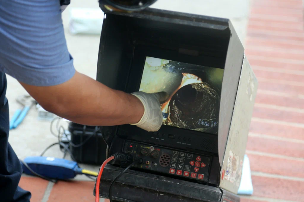 Technician viewing a drain inspection camera in Loma Linda