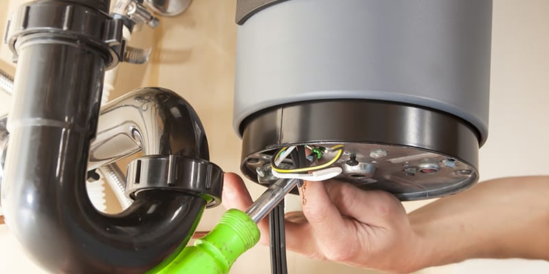 Technician repairing the heating element of a water heater in Loma Linda