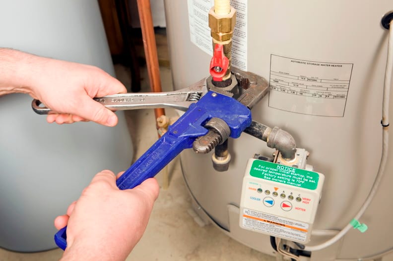 Plumber repairing a water heater valve in Loma Linda